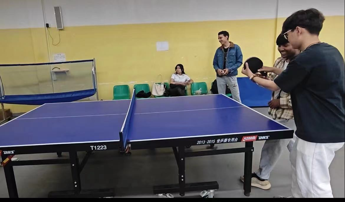 Chinese Students Teaching International Students Table Tennis Techniques