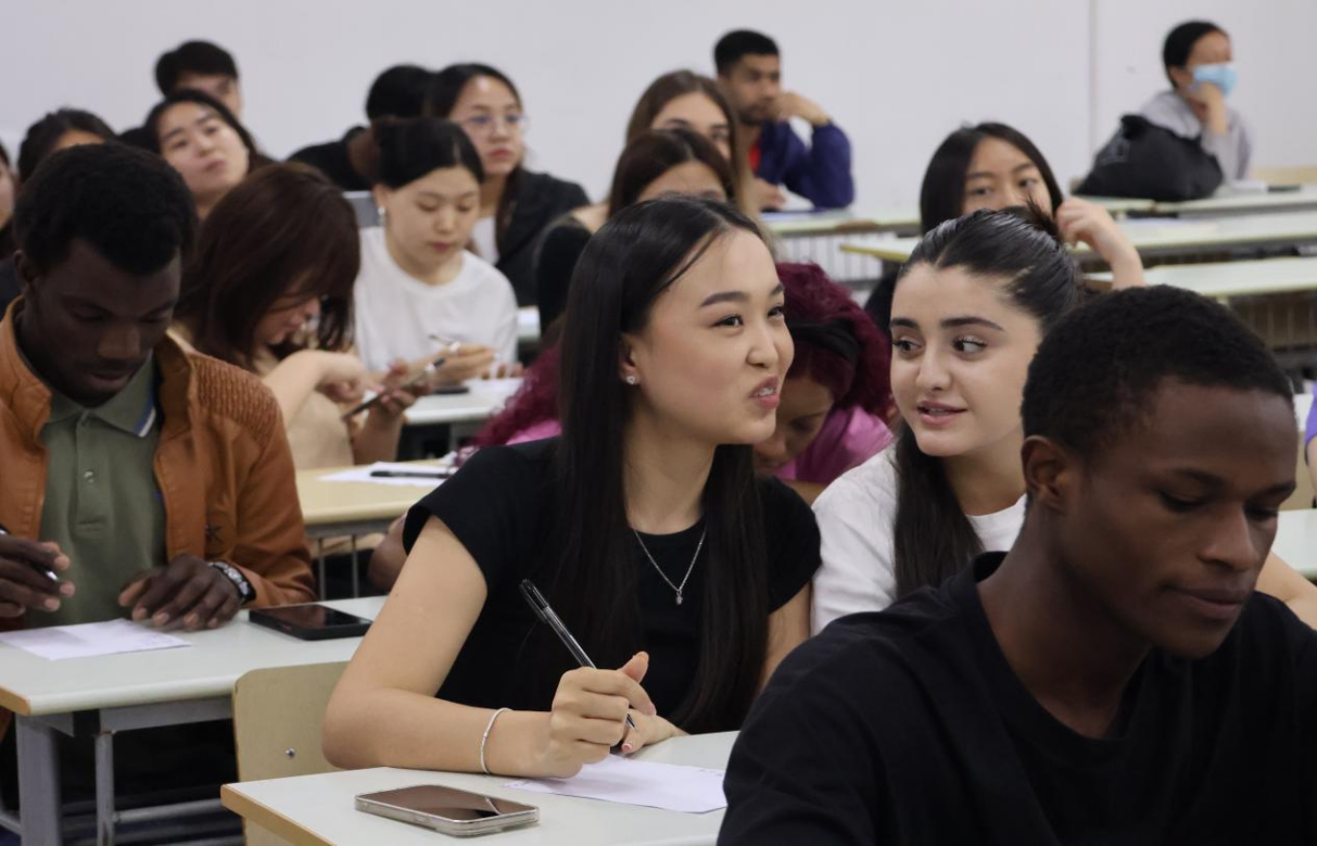 International Students Discussing the Strokes of Chinese Characters