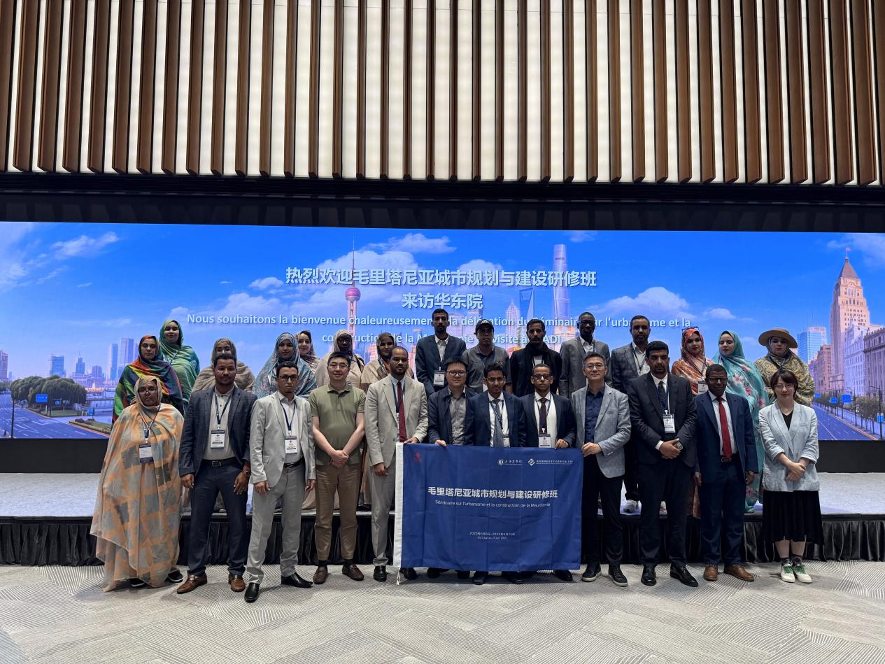 Photo: Participants taking a group photo at ECADI